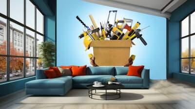 Construction tools and helmet in cardboard box Wall mural