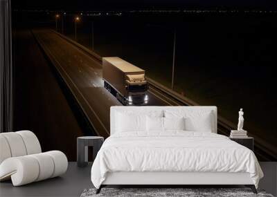 A large european semi-trailer moves along the highway at night with its headlights on. Generative AI Wall mural