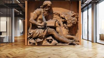 Saint Mark the Evangelist relief on house facade in Modena, Italy  Wall mural