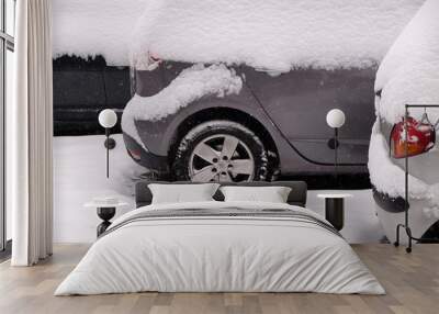 Snow covered car parked in streets of Zagreb, Croatia  Wall mural