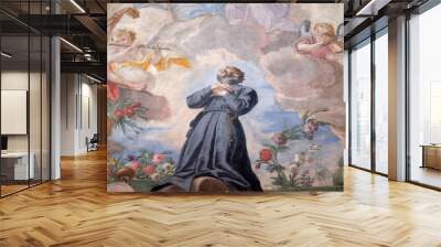 St. Francis kneeling on a cloud surrounded by music making angels, fresco on the ceiling of the Jesuit church of St. Francis Xavier in Lucerne, Switzerland Wall mural