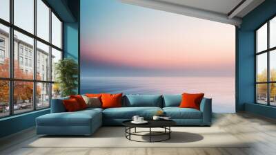 sun and clouds sunset over sea soft light blue peach pink pastel calm ocean Wall mural