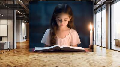 Little girl reading holy bible book. Wall mural