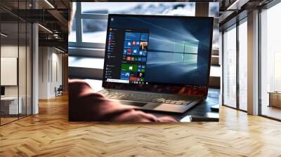 Man typing on a windows 10 laptop Wall mural