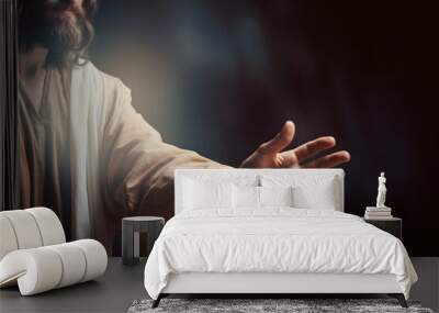 Jesus reaching out his hand against dark background Wall mural