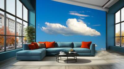 white fluffy clouds in the blue sky Wall mural