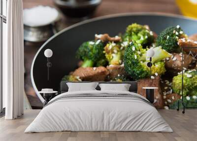 Fried broccoli and beef in pan Wall mural