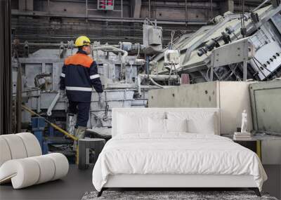 the smelter worker controls the aluminum smelting process Wall mural