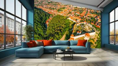 Aerial view of Rasnov Fortress and Rasnov city and forest around in Brasov, Transylvania, Romania Wall mural