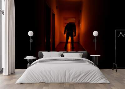 Dark corridor with cabinet doors and lights with silhouette of spooky horror man standing with different poses. Wall mural