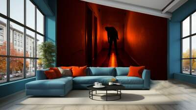 Dark corridor with cabinet doors and lights with silhouette of spooky horror man standing with different poses. Wall mural