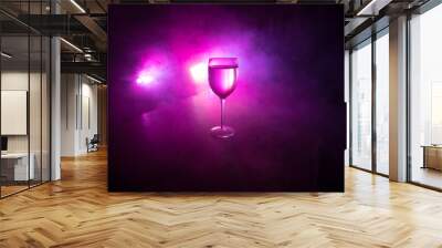 Goblet of white wine on wooden table on wooden wall background Wall mural