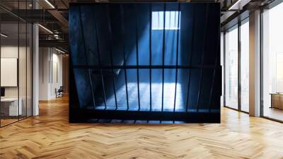 Jail or prison cell. Old grunge prison miniature. Dark prison interior creative decoration. Empty cell. Selective focus Obsolete gray grunge concrete room. Wall mural