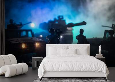 Military patrol car on sunset background. Army war concept. Silhouette of armored vehicle with soldiers ready to attack. Artwork decoration. Selective focus Wall mural