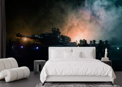 Military patrol car on sunset background. Army war concept. Silhouette of armored vehicle with soldiers ready to attack. Artwork decoration. Selective focus Wall mural