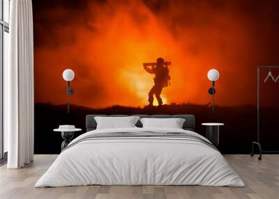 Military soldier silhouette with bazooka. War Concept. Military silhouettes fighting scene on war fog sky background, Soldier Silhouette aiming to the target at night Wall mural