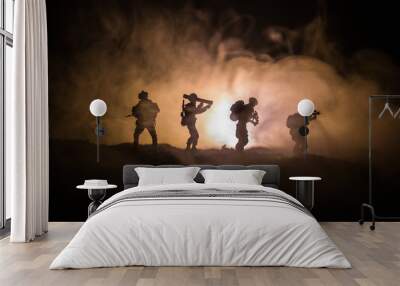 Military soldier silhouette with gun. War Concept. Military silhouettes fighting scene on war fog sky background, World War Soldier Silhouette Below Cloudy Skyline At night. Wall mural