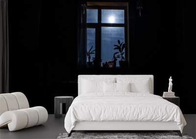 Night scene of moon seen through the window from dark room Wall mural