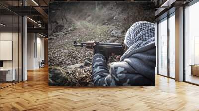 Silhouette of man with assault rifle ready to attack on dark toned foggy background or dangerous bandit holding gun in hand. Shooting terrorist with weapon theme decor Wall mural