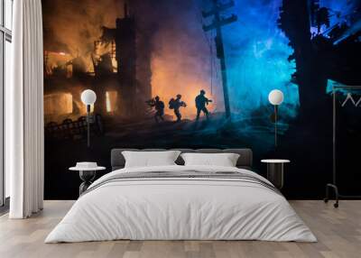 War Concept. Military silhouettes fighting scene on war fog sky background, World War Soldiers Silhouette Below Cloudy Skyline At night. Wall mural