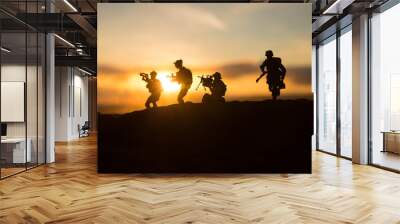 War Concept. Military silhouettes fighting scene on war fog sky background, World War Soldiers Silhouette Below Cloudy Skyline At sunset. Wall mural