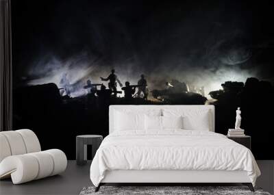 War Concept. Military silhouettes fighting scene on war fog sky background, World War Soldiers Silhouettes Below Cloudy Skyline At night. Attack scene. Armored vehicles. Wall mural