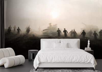 War Concept. Military silhouettes fighting scene on war fog sky background, World War Soldiers Silhouettes Below Cloudy Skyline at sunset. Attack scene. Armored vehicles. Wall mural