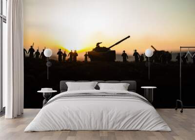 War Concept. Military silhouettes fighting scene on war fog sky background, World War Soldiers Silhouettes Below Cloudy Skyline at sunset. Attack scene. Armored vehicles. Wall mural