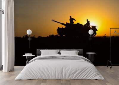 War Concept. Military silhouettes fighting scene. World War German Tanks and soldiers silhouettes at sunset. Attack scene. Armored vehicles. Wall mural