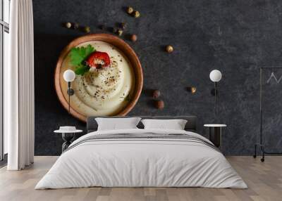 Creamy sauce with garlic, eggs and pepper on a black background. Wall mural