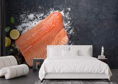 Salmon filet with lemon and spices on a black background.Flatly food Wall mural