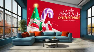 Merry christmas text vector design. Christmas ornaments and elements like pine tree, candy cane, santa hat and gift boxes in snow frost outdoor. Vector illustration winter season background. Wall mural