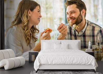 Couple enjoying lunch sitting at cafe table Wall mural