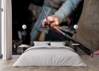 blacksmith working on an anvil Wall mural