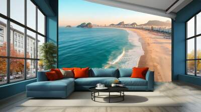 Aerial view of Copacabana Beach in Rio de Janeiro Brazil showcasing the iconic shoreline with gentle waves meeting the sandy beach and the vibrant cityscape in the background under a clear blue Wall mural