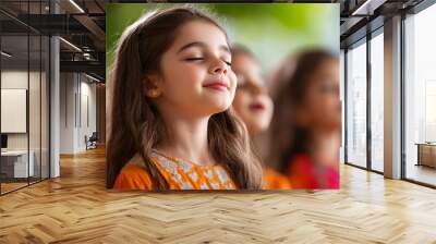 Young girl with closed eyes and a peaceful expression Wall mural