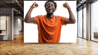 A man in an orange shirt is smiling and raising his arms in the air. Concept of joy and excitement Wall mural