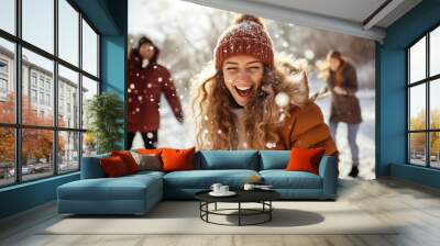 friends having fun in snow - happy friends fighting with snowballs outdoors in winter - lifestyle concept with guys and girls enjoying sunny day Wall mural