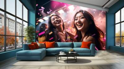 two young asian girls dancing in the nightclub. party and concert advertising campaign background. Wall mural