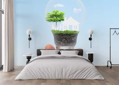 Green eco energy concept. Tree growing inside light bulb. nature background. Think green and Ecological concept. world environment day. Wall mural