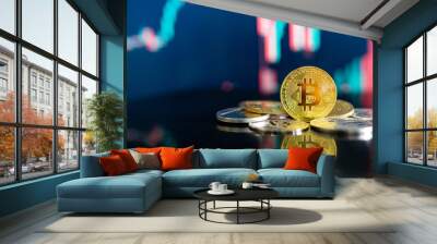 bitcoin and other crypto coins on reflecting table. blurred candlestick chart in the background. btc Wall mural