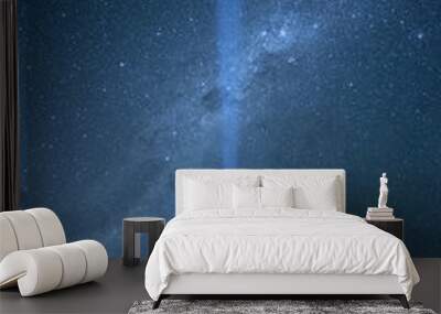 Flashlight lighting in the dark sky crossing southern Milky Way, star gazing night photography concept Wall mural