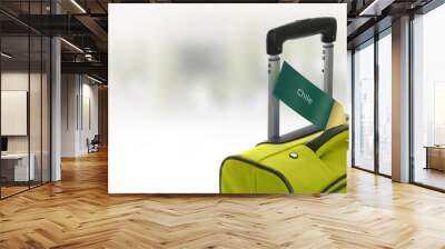 Chile. Green suitcase with label at airport. Wall mural