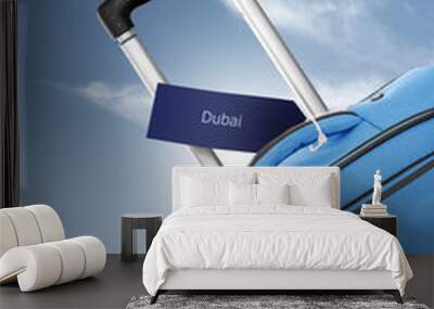 Dubai. Blue suitcase with label Wall mural