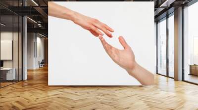 Hands of man and woman reaching out to each other Wall mural