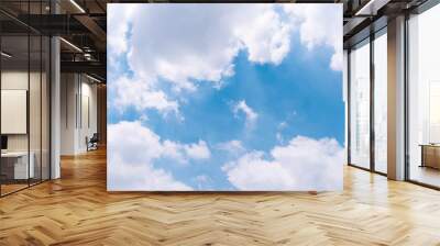 The vast blue sky with large group of fluffy clouds in sunny day of summer, peaceful skies background Wall mural