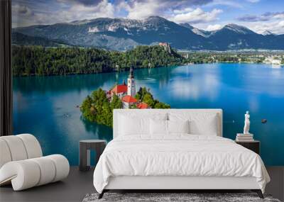 Bled, Slovenia - Aerial view of Lake Bled (Blejsko Jezero) with the Pilgrimage Church of the Assumption of Maria, pletna boats, Bled Castle and Julian Alps on a sunny summer day Wall mural