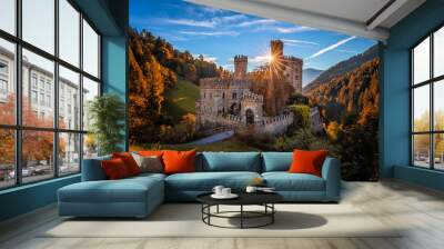 Latzfons, Italy - Beautiful autumn scenery at Gernstein Castle (Castello di Gernstein, Schloss Gernstein) at sunrise in South Tyrol with blue sky, sunrays and golden foliage Wall mural