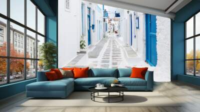 mykonos, greece - traditional whitewashed street of mykonos town with blue windows and doors on a su Wall mural