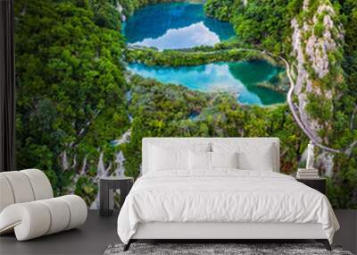 Plitvice, Croatia - Amazing view of the beautiful waterfalls of Plitvice Lakes in Plitvice National Park on a bright summer day with blue sky and clouds and green foliage and turquoise water Wall mural